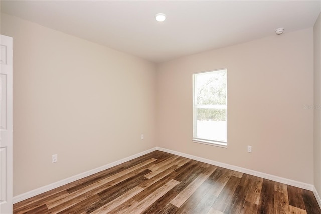 unfurnished room featuring hardwood / wood-style flooring