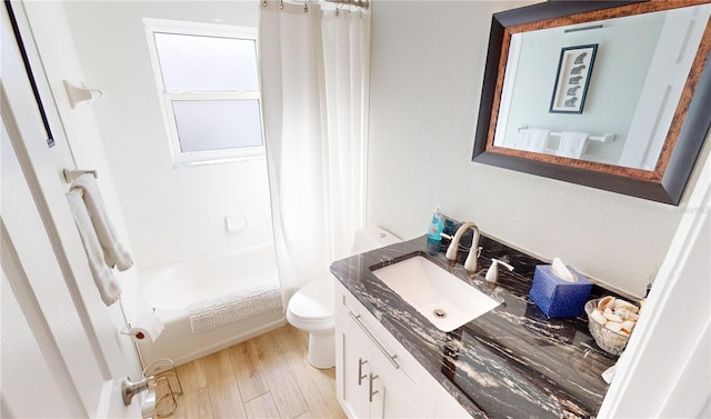 full bathroom with vanity, hardwood / wood-style flooring, toilet, and shower / tub combo with curtain