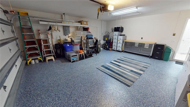 garage featuring a garage door opener and electric panel