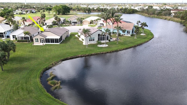 birds eye view of property featuring a water view