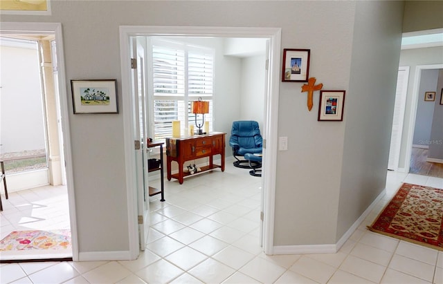 hallway featuring light tile patterned flooring