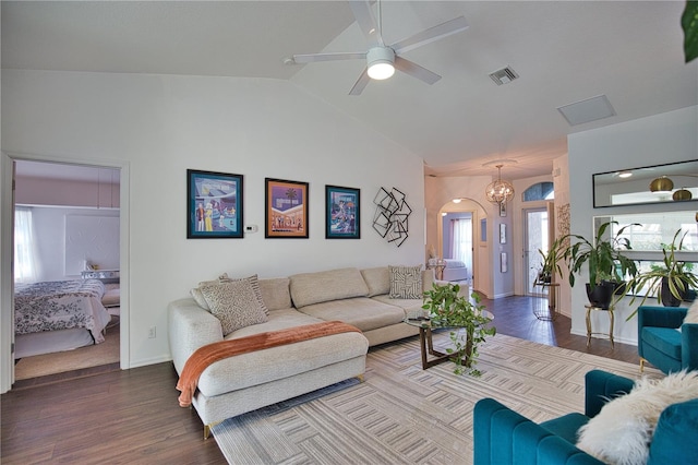 living room featuring lofted ceiling, hardwood / wood-style floors, and ceiling fan