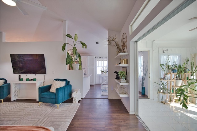 entryway featuring hardwood / wood-style flooring, ceiling fan, and vaulted ceiling