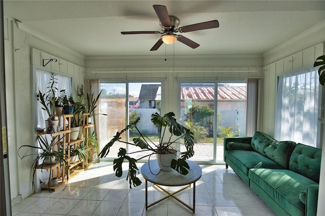 sunroom featuring ceiling fan