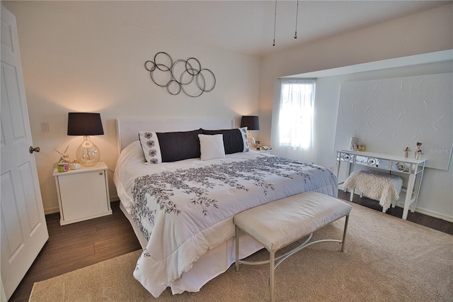 bedroom featuring dark hardwood / wood-style flooring