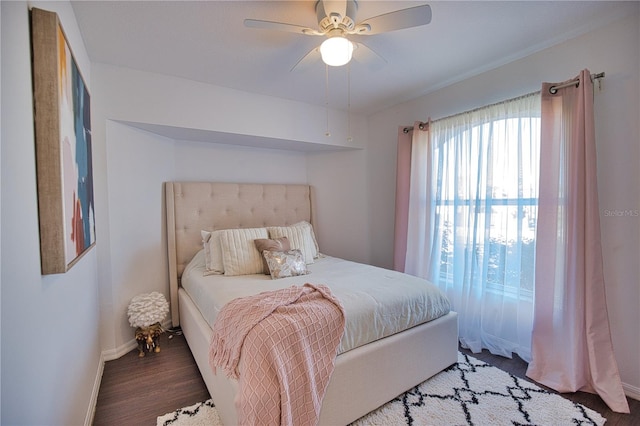 bedroom with hardwood / wood-style floors and ceiling fan