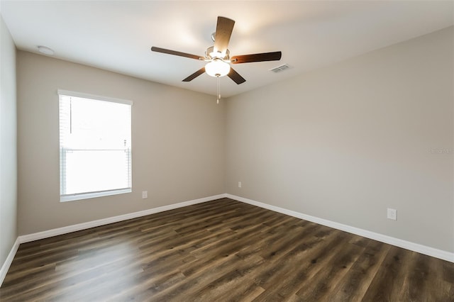 unfurnished room featuring ceiling fan and dark hardwood / wood-style floors