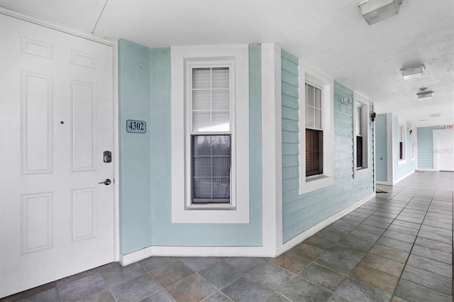 doorway to property with a porch