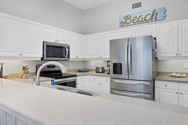 kitchen with white cabinets and stainless steel appliances