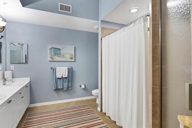 bathroom featuring tile patterned floors, curtained shower, vanity, and toilet