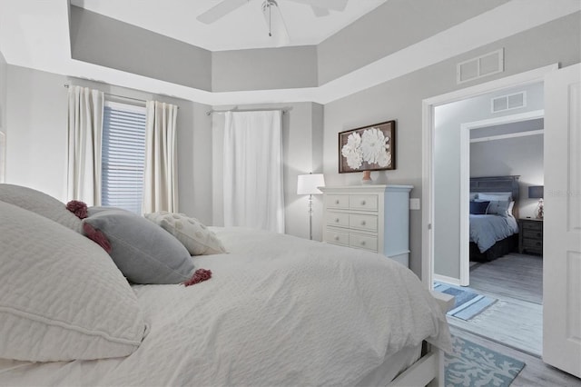 bedroom with ceiling fan and light hardwood / wood-style flooring