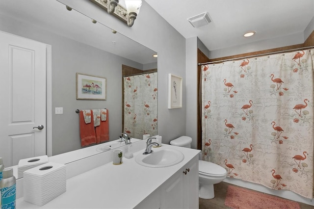 bathroom with tile patterned floors, vanity, and toilet