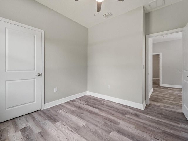 unfurnished room featuring ceiling fan and light hardwood / wood-style flooring