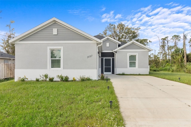 ranch-style house with a front lawn