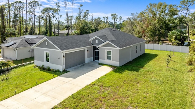 ranch-style home with a garage and a front lawn