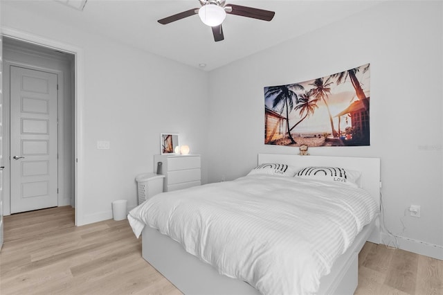 bedroom with light hardwood / wood-style flooring and ceiling fan