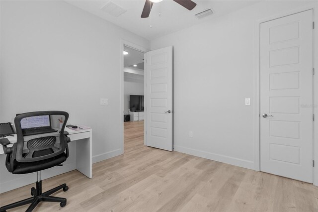 office space featuring ceiling fan and light hardwood / wood-style flooring