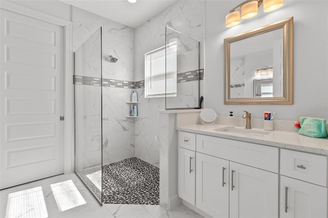 bathroom with vanity and tiled shower