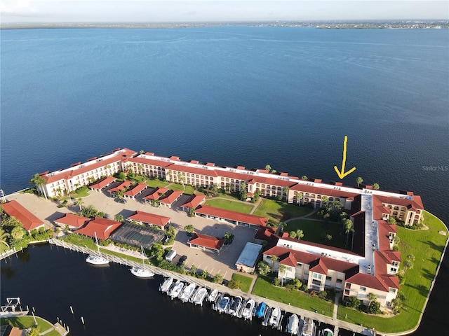 birds eye view of property with a water view