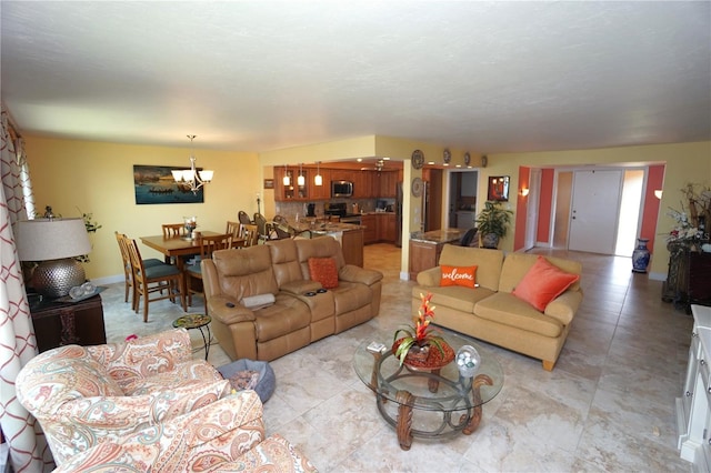 living room with a notable chandelier