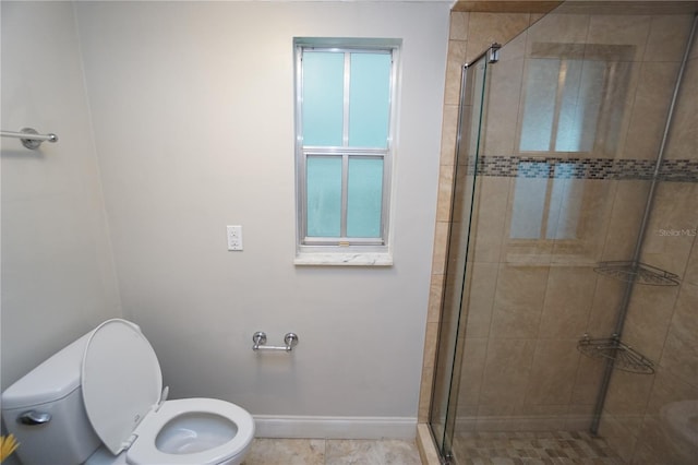 bathroom with toilet and an enclosed shower