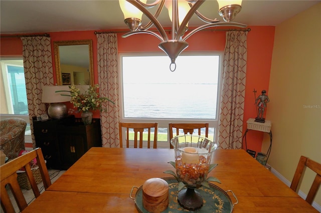 dining area featuring a notable chandelier