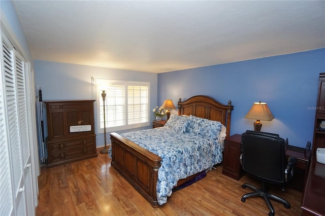 bedroom with hardwood / wood-style floors