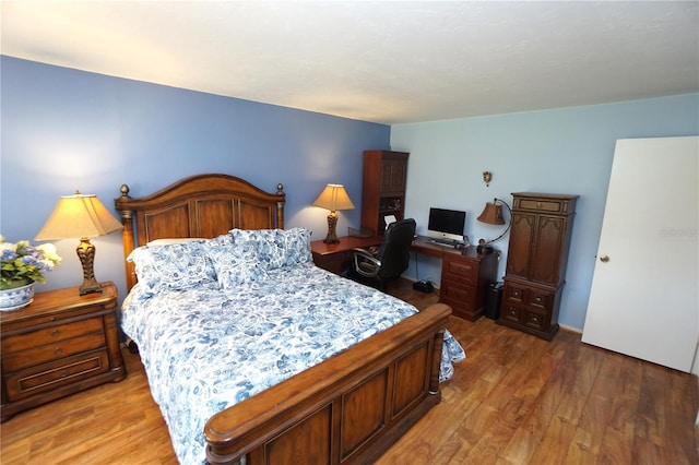 bedroom featuring hardwood / wood-style floors