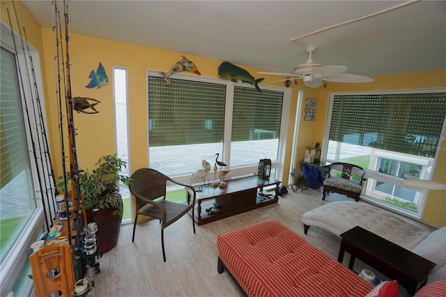 sunroom / solarium with ceiling fan