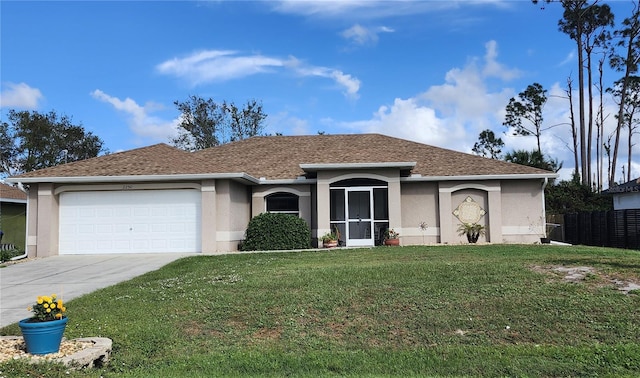 single story home featuring a garage and a front lawn