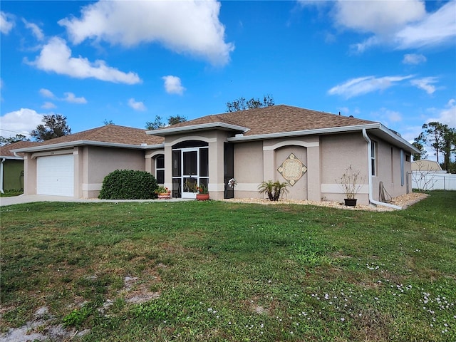 ranch-style house with a garage and a front lawn