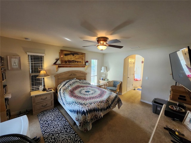 bedroom with light carpet and ceiling fan