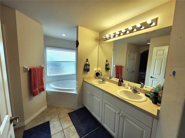 bathroom with vanity, tile patterned floors, and a relaxing tiled tub