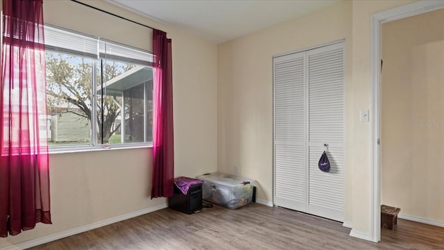 bedroom featuring light wood-type flooring and a closet