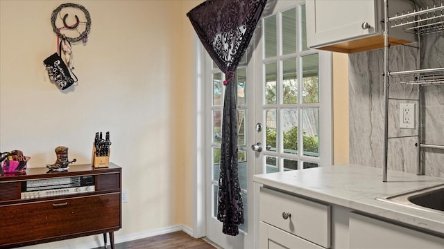 doorway to outside featuring dark hardwood / wood-style flooring