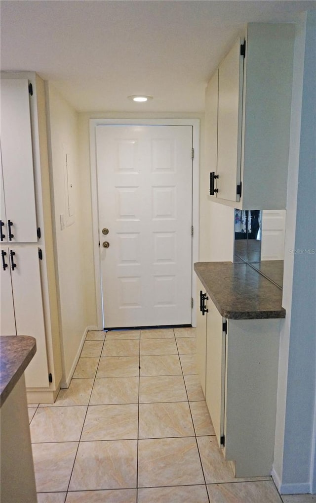 entryway featuring light tile patterned floors