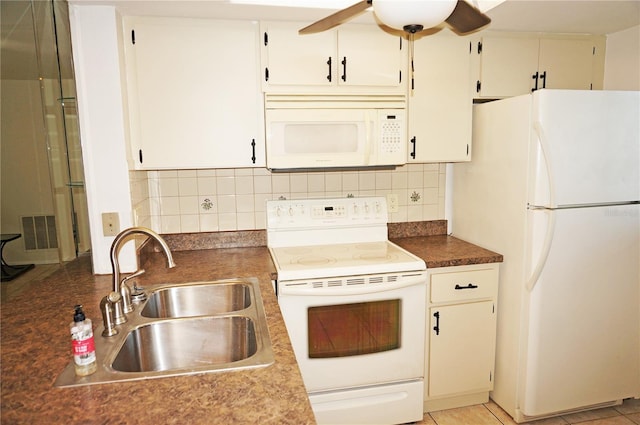 kitchen with tasteful backsplash, white cabinetry, light tile patterned floors, sink, and white appliances