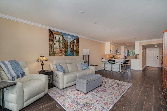 living room with dark hardwood / wood-style flooring and ornamental molding