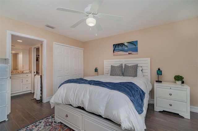 bedroom with dark hardwood / wood-style flooring, a closet, ceiling fan, and ensuite bathroom