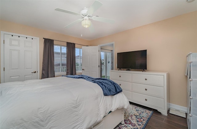 bedroom featuring access to exterior, ceiling fan, and dark wood-type flooring