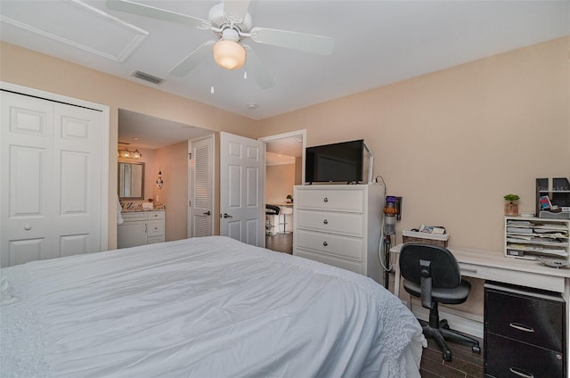 bedroom featuring connected bathroom, ceiling fan, and dark hardwood / wood-style flooring