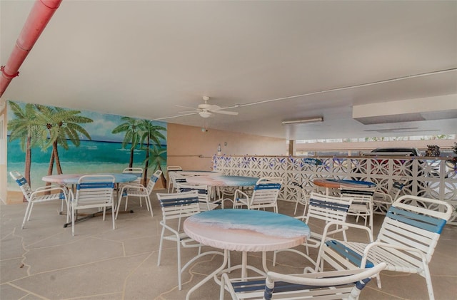 dining room featuring ceiling fan