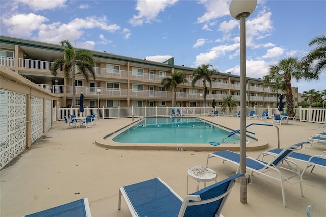 view of swimming pool featuring a patio area