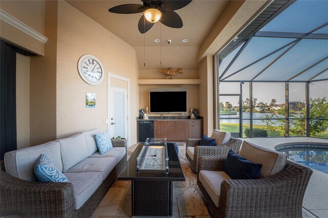 view of patio with outdoor lounge area, ceiling fan, and a hot tub