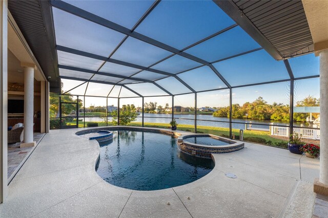 view of swimming pool featuring a lanai, a water view, an in ground hot tub, and a patio