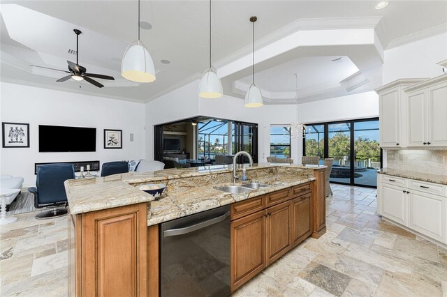 kitchen featuring pendant lighting, dishwasher, white cabinets, and a spacious island