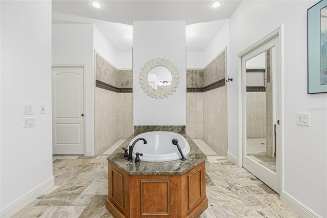 bathroom with separate shower and tub