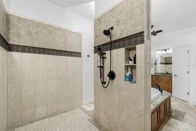 bathroom with ceiling fan, vanity, and independent shower and bath