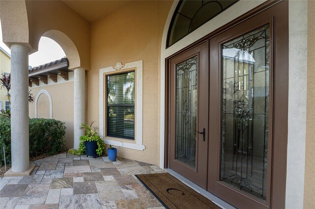 property entrance featuring french doors