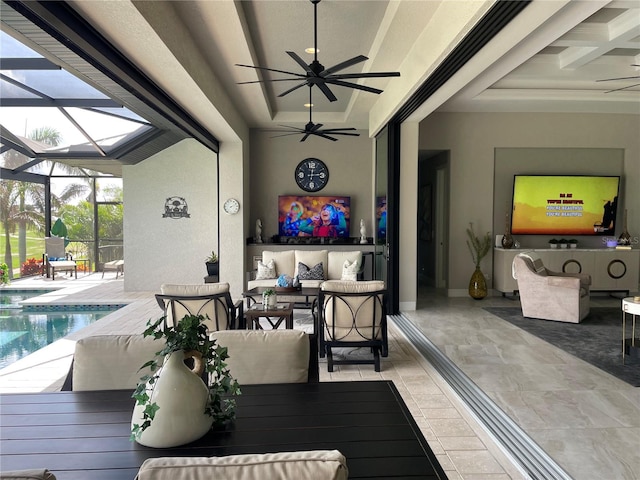 view of patio featuring glass enclosure and ceiling fan